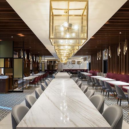 Dusit Doha Hotel Buitenkant foto The interior of the lounge