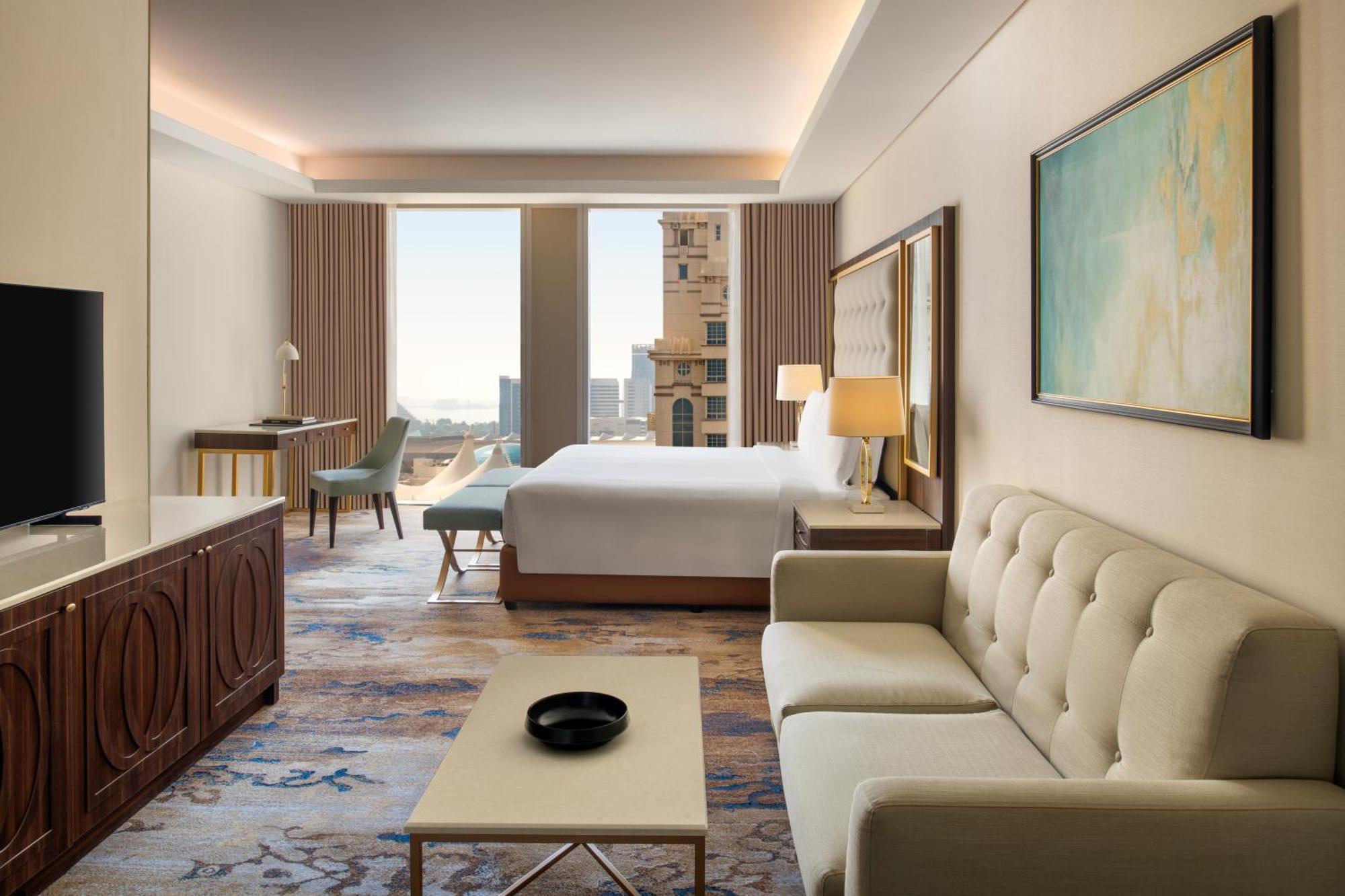 Dusit Doha Hotel Buitenkant foto A guest room at the hotel