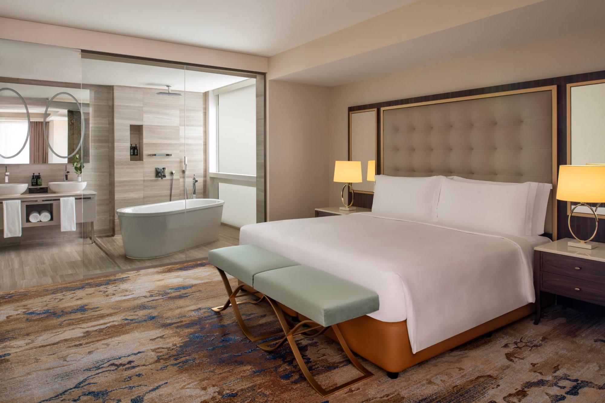 Dusit Doha Hotel Buitenkant foto A bedroom at the hotel